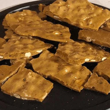 Pieces of cashew brittle on a platter
